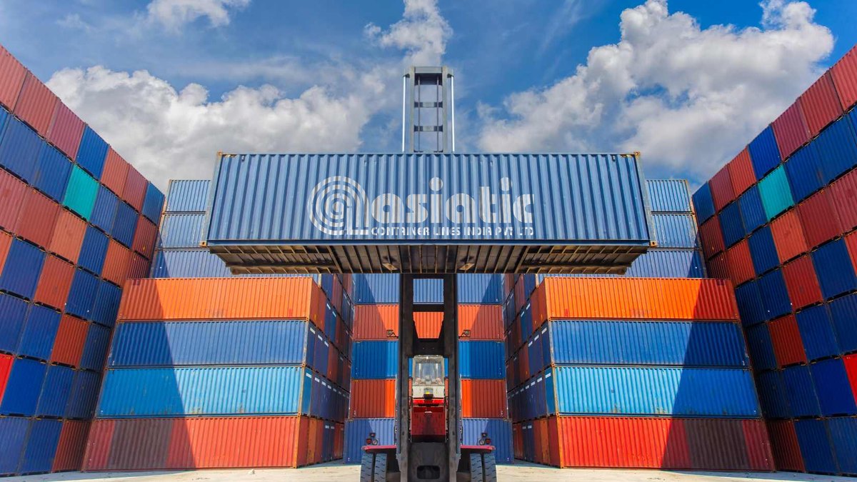 Reach stacker lifting a container between yard stacks